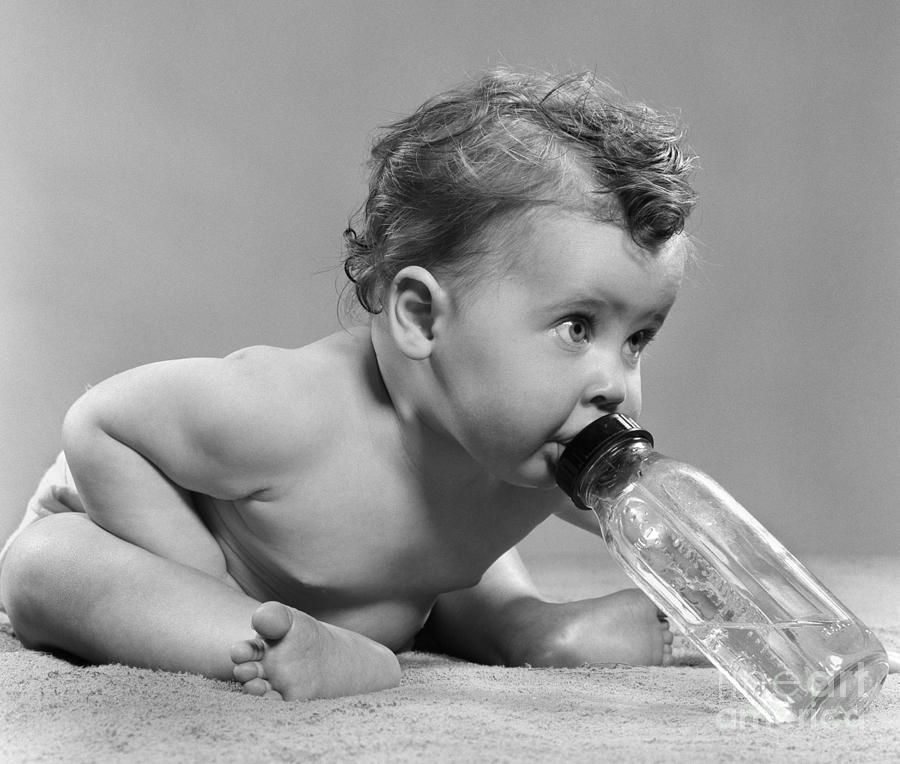 Baby Drinking From Bottle, C.1950s Photograph by H. Armstrong Roberts/ClassicStock