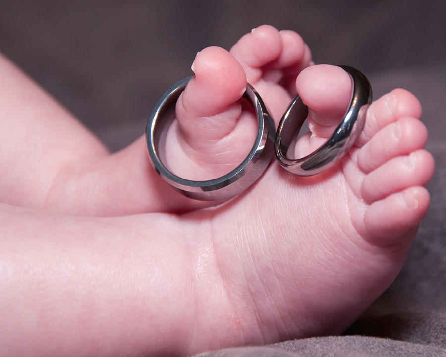 Baby Feet With Wedding Rings Photograph by Susan Cliett