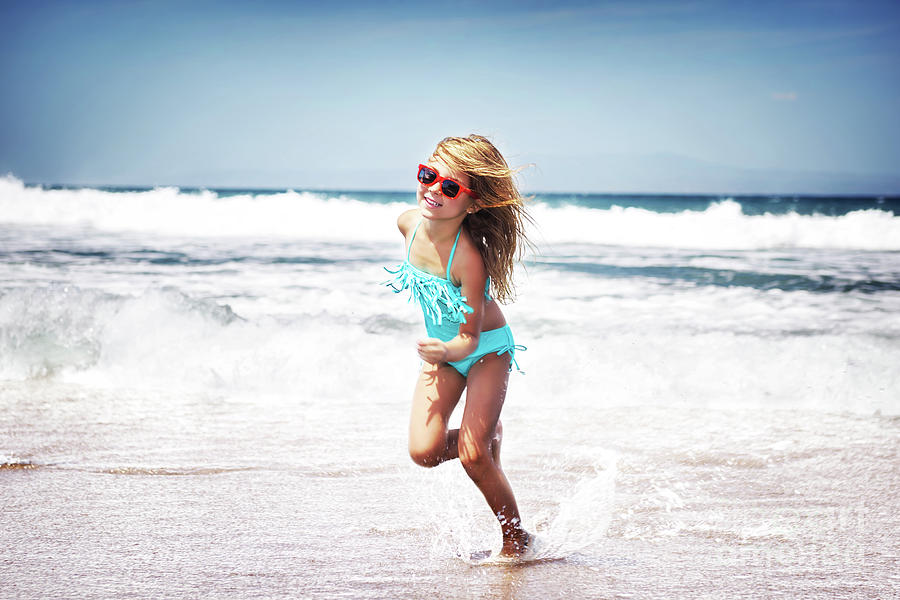 Baby girl running on a beach Photograph by Anna Om
