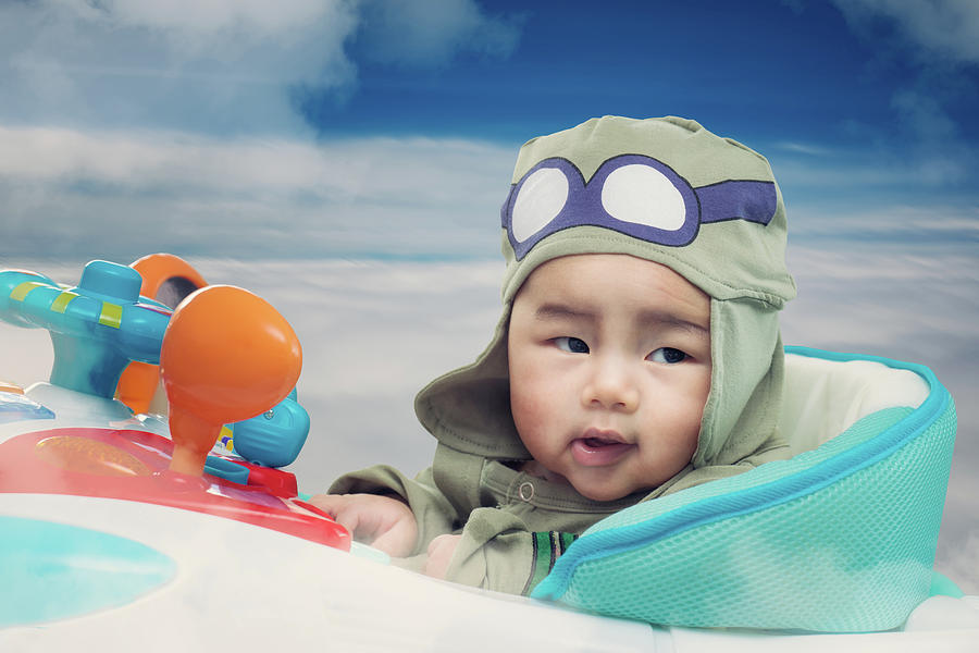 Baby play on airplane toy on the sky Photograph by Anek Suwannaphoom