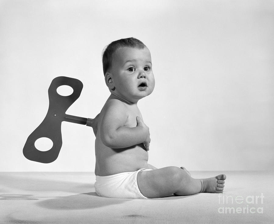 Baby With Windup Key, C.1960-70s Photograph by H. Armstrong Roberts/ClassicStock