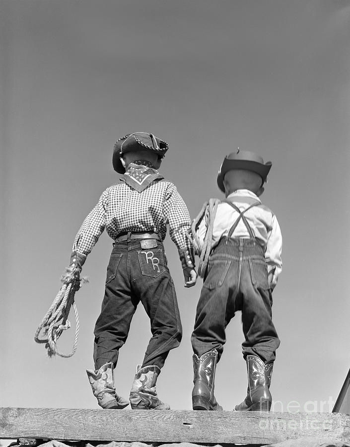 Back View Of Boys In Cowboy Costumes Photograph by D. Corson/ClassicStock