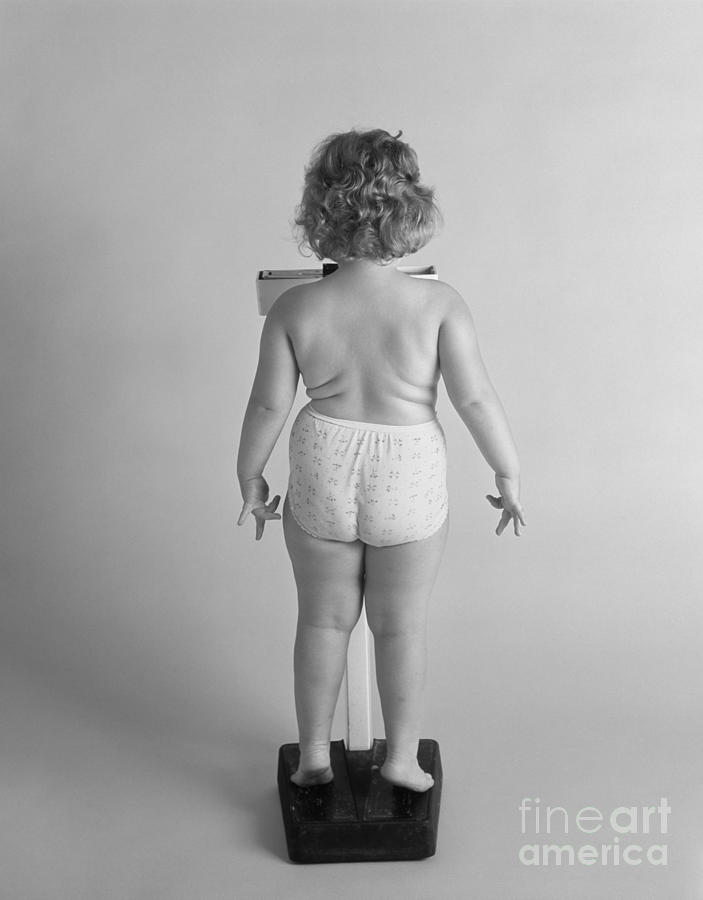 Back View Of Chubby Girl On Scale Photograph by Photo Media/ClassicStock