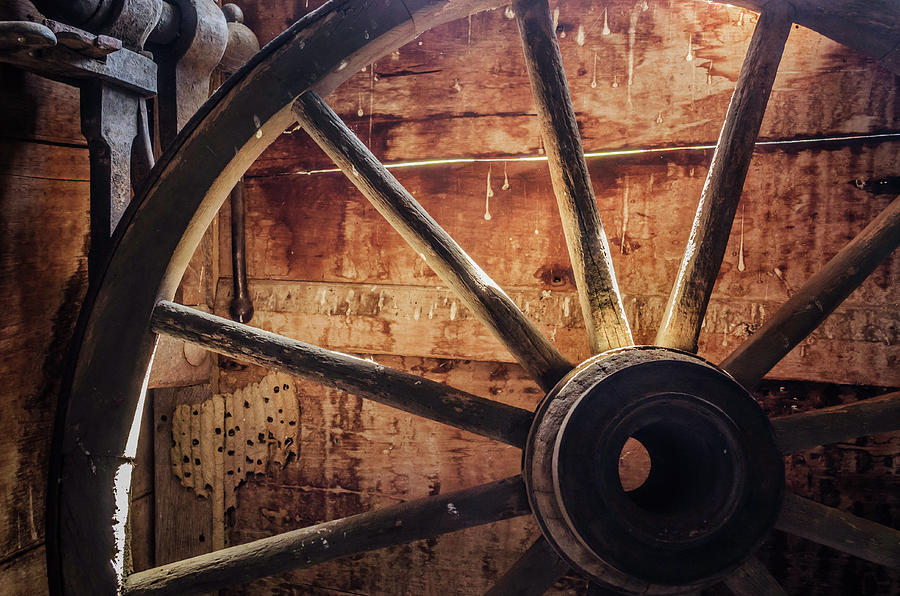 Backlit wagon wheel Photograph by Jim Love