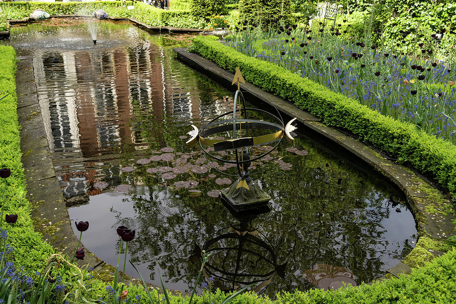 Backyard Tranquility - a Fountain in a Beautifully Landscaped Garden Photograph by Georgia Mizuleva