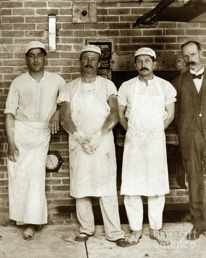 Bakers Photograph - Bakers standing with  hands covered in sticky dough in front of  by Monterey County Historical Society