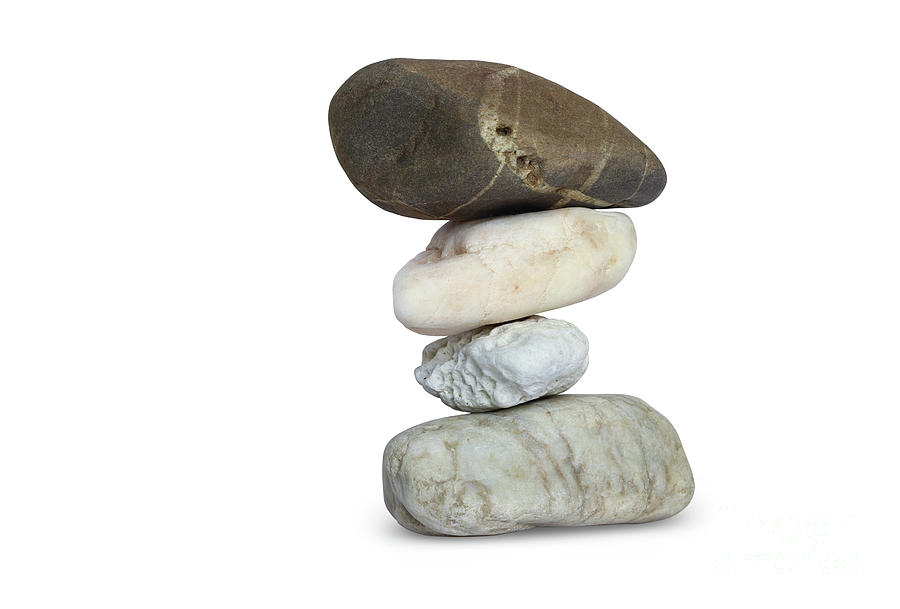 Balancing stone tower on white background Photograph by Michal Boubin