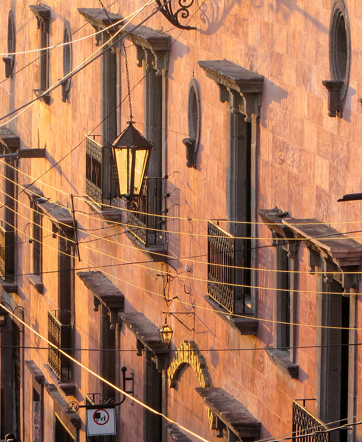 Balconies and wires at sunset. Photograph by Rob Huntley