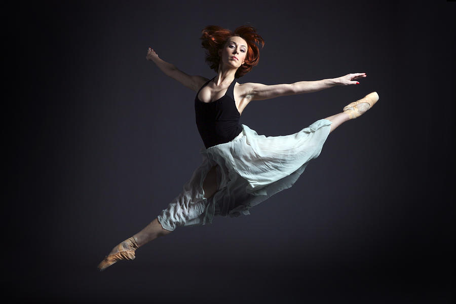 Ballerina in Flying Pose Photograph by Artur Bogacki