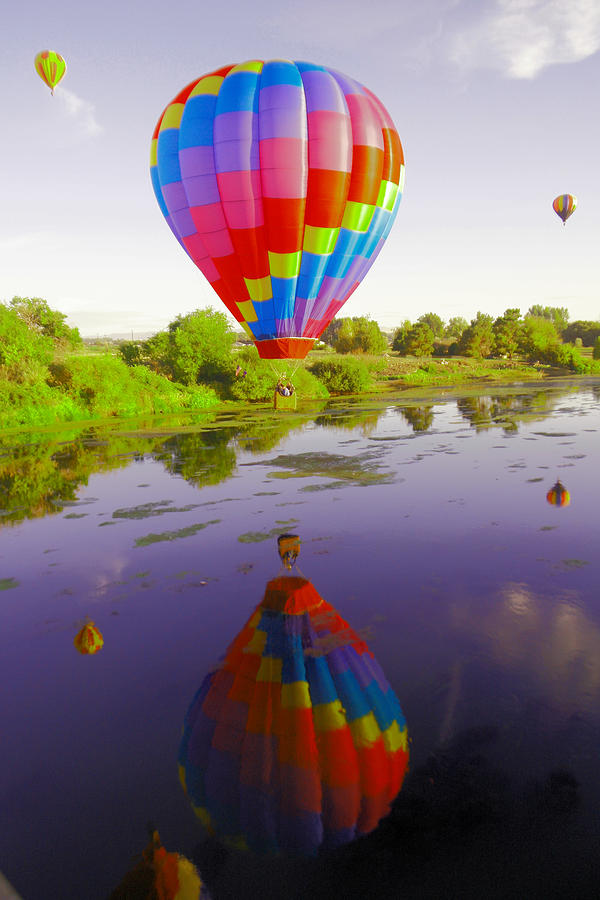 Balloon reflecting in the water Photograph by Jeff Swan