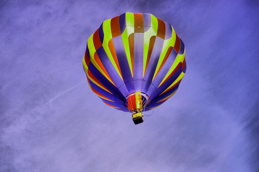 Balloon rising Photograph by Jeff Swan