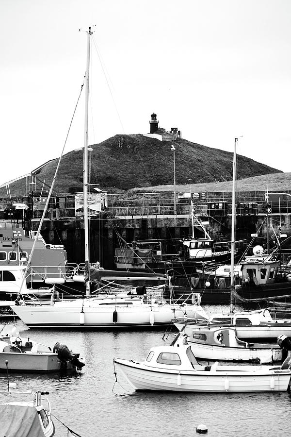 Ballycotton Ireland Marina Harbor Boats and Lighthouse County Cork Black and White Photograph by Shawn OBrien