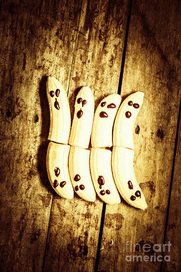 Halloween Photograph - Banana ghosts looking to split at halloween party by Jorgo Photography