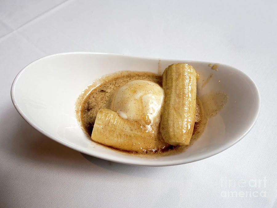 Bananas Foster in a white dish Photograph by Louise Heusinkveld