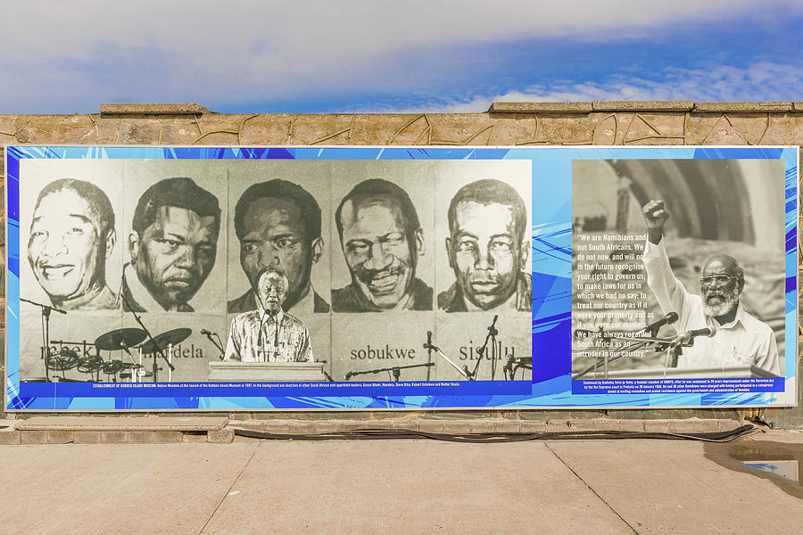 Banner on the wall at the dock at Robben Island Photograph by Marek Poplawski