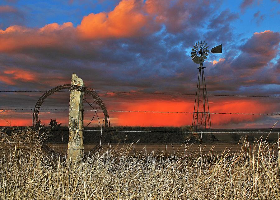 Barbed wire, rock post and windmill in Kansas Photograph by Greg Rud ...