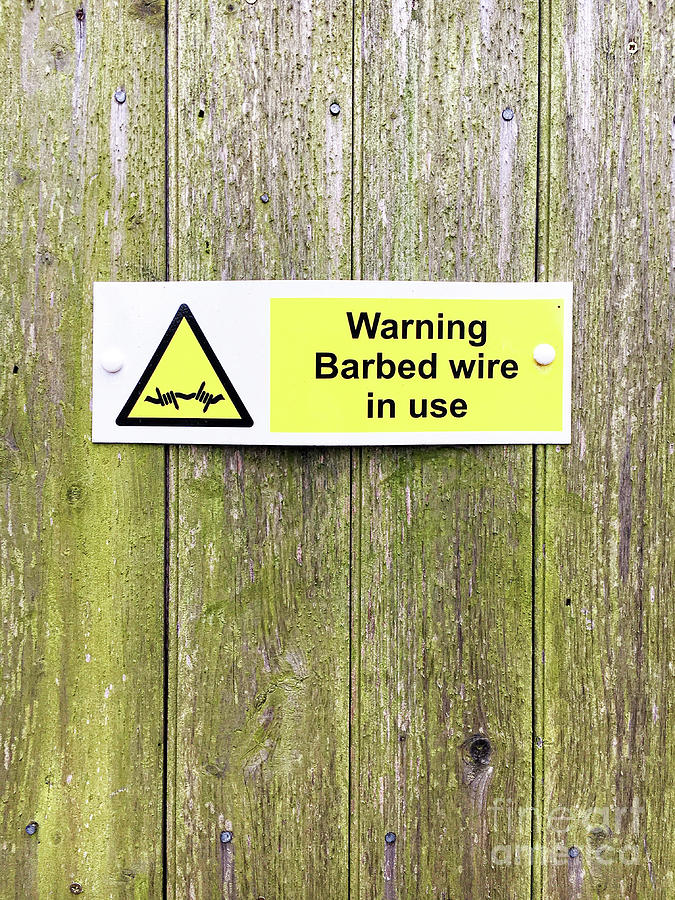Barbed wire warning  Photograph by Tom Gowanlock