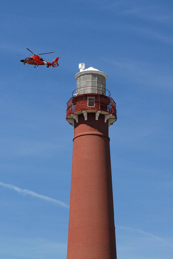Barnegat Lighthouse and Helicopter Photograph by Joyce StJames