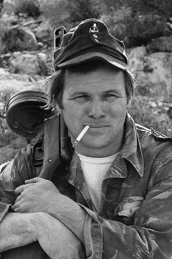 Barry Sadler holding one of his numerous  machine guns  Tucson Arizona 1971 Photograph by David Lee Guss
