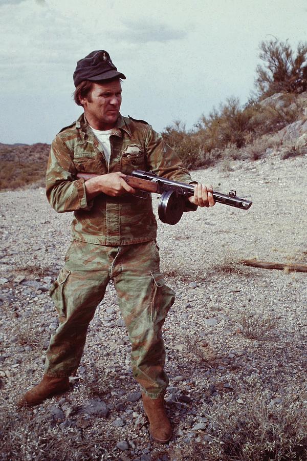 Barry Sadler Shooting A Machine Gun In The Desert  color Tucson Arizona 1971 Photograph by David Lee Guss