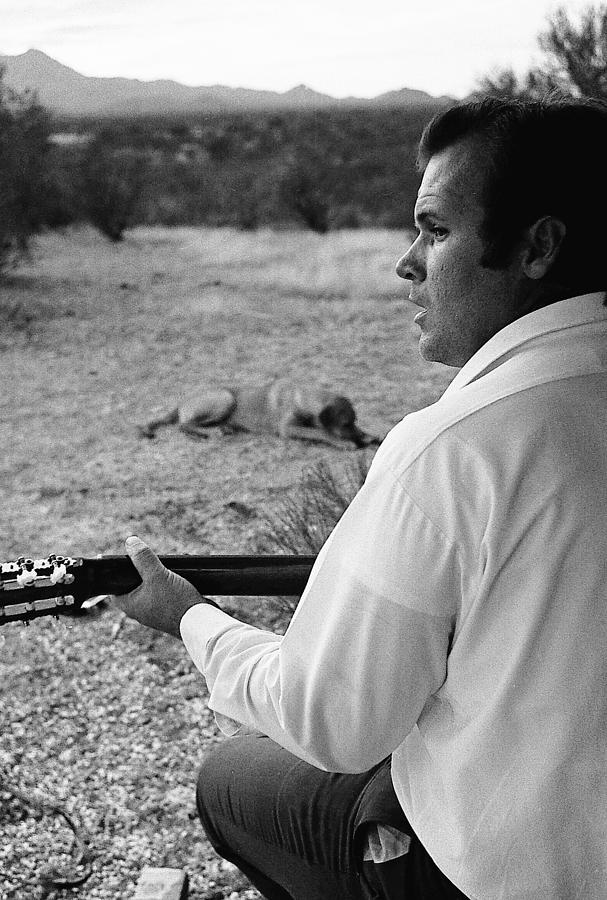 Barry Sadler with guitar 4 Tucson  Arizona 1971. Photograph by David Lee Guss