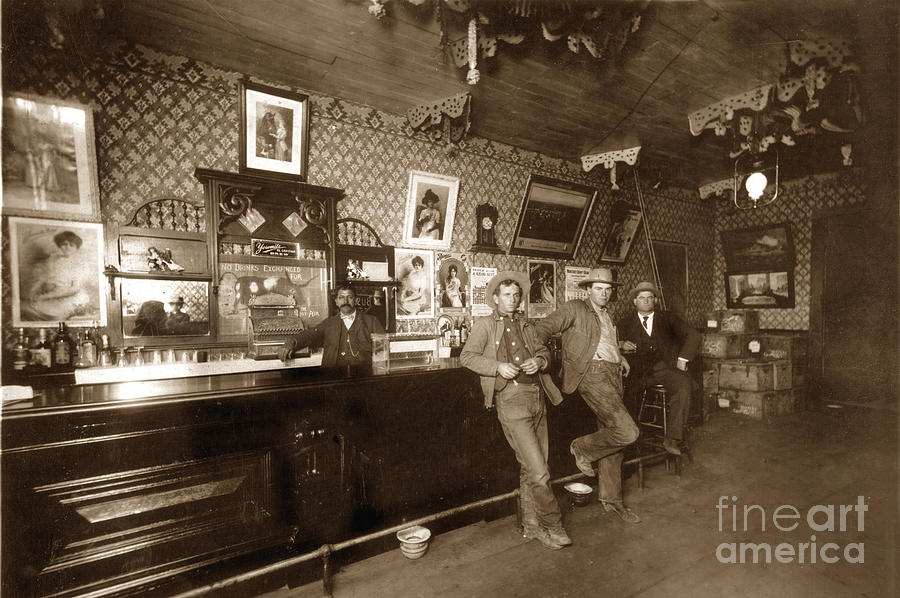 Beer Photograph - Bartender behind Bar Interior Feb. 1910 by Monterey County Historical Society