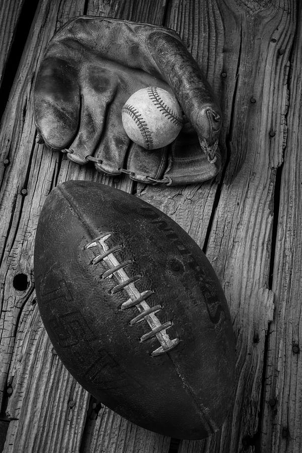 Baseball Mitt And Football Photograph by Garry Gay