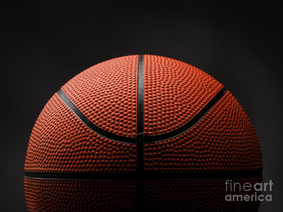 Basketball on dark background Photograph by Andreas Berheide