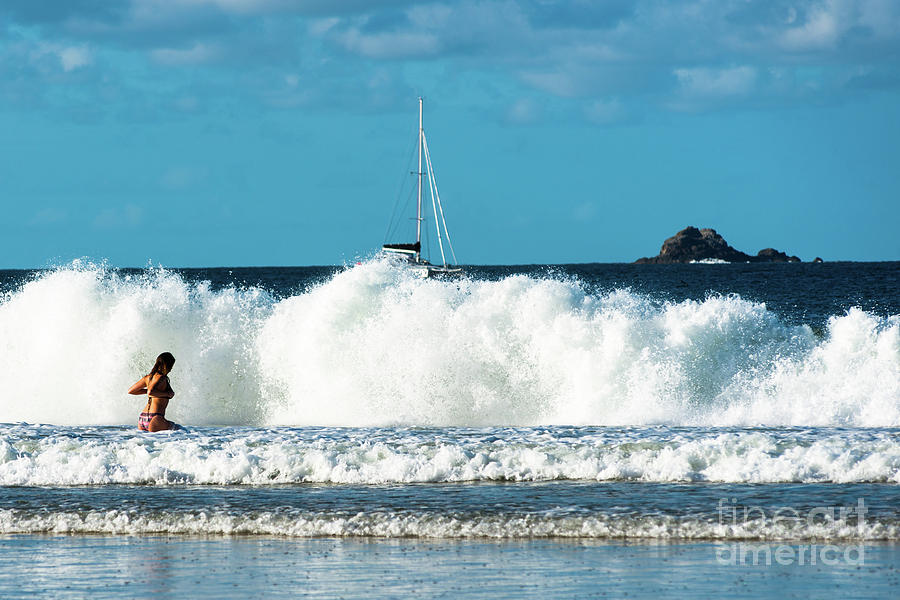 Bathers face large waves  Photograph by Andrew Michael