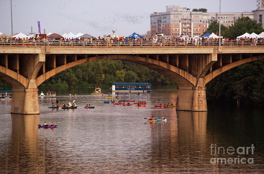 Bats take flight during the Austin Bat Fest as bat watchers watch from the Congress Bridge