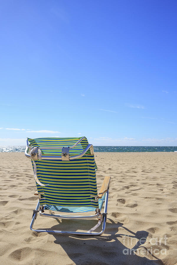 Beach Chair on a sandy beach Photograph by Edward Fielding