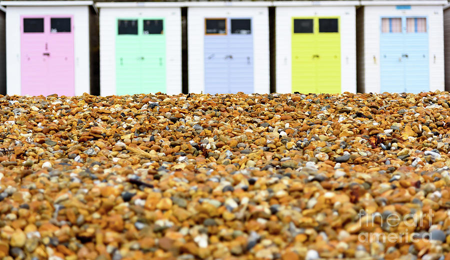 Pebbles Photograph - Beach huts and pebbles by Colin Rayner