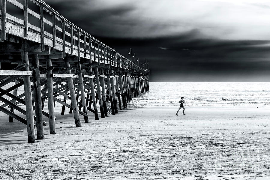 Beach Jogger at Sunset Beach Photograph by John Rizzuto