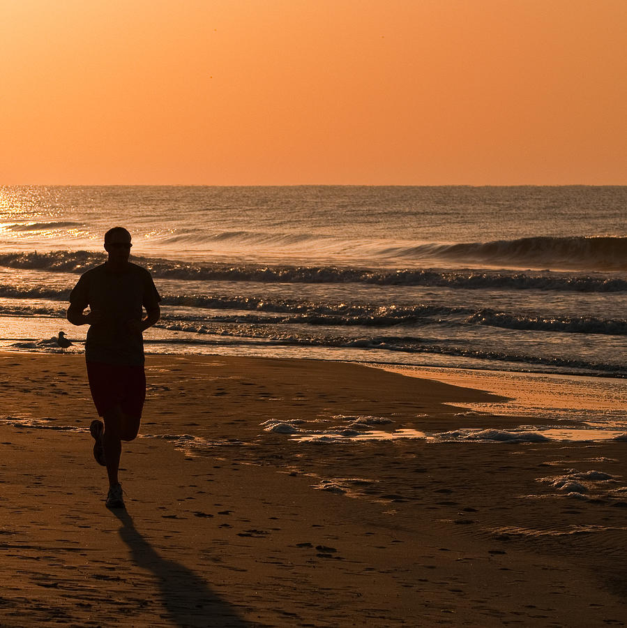 Beach Runner Photograph by Russell G Hunt