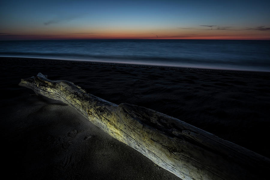 Beach scene with light painted driftwood Photograph by Sven Brogren