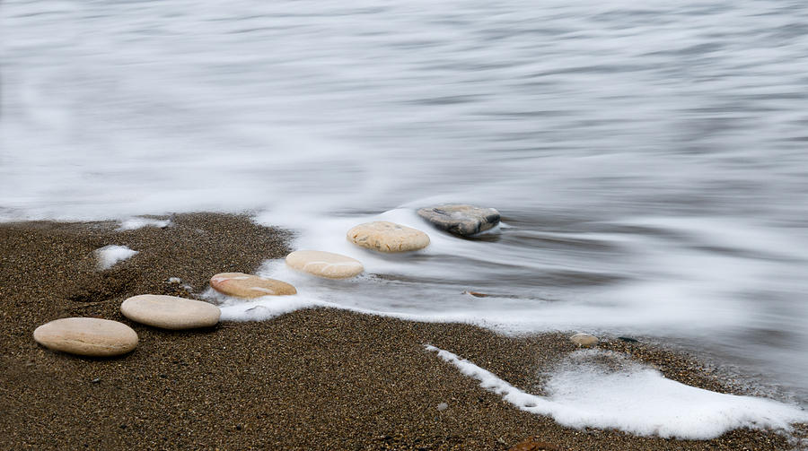 Beach stones in a row Photograph by Michalakis Ppalis