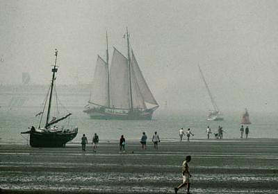 Seascape Photograph - Beached Ship And People by PJ Steinmeijer Seascape Photograph - Beached Ship And People by PJ Steinmeijer