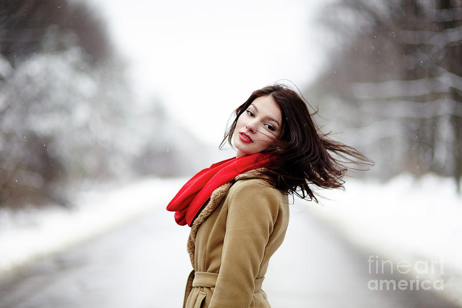 Beautiful brunette with hair blown by wind in the winter Photograph by Ragnar Lothbrok