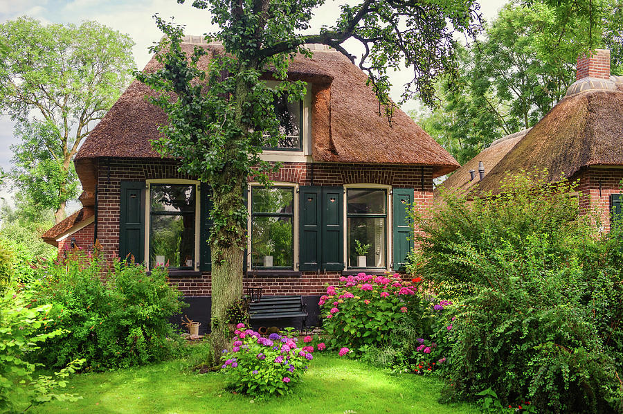 Beautiful Cottage With Green Garden In Giethoorn. The Netherlands Photograph