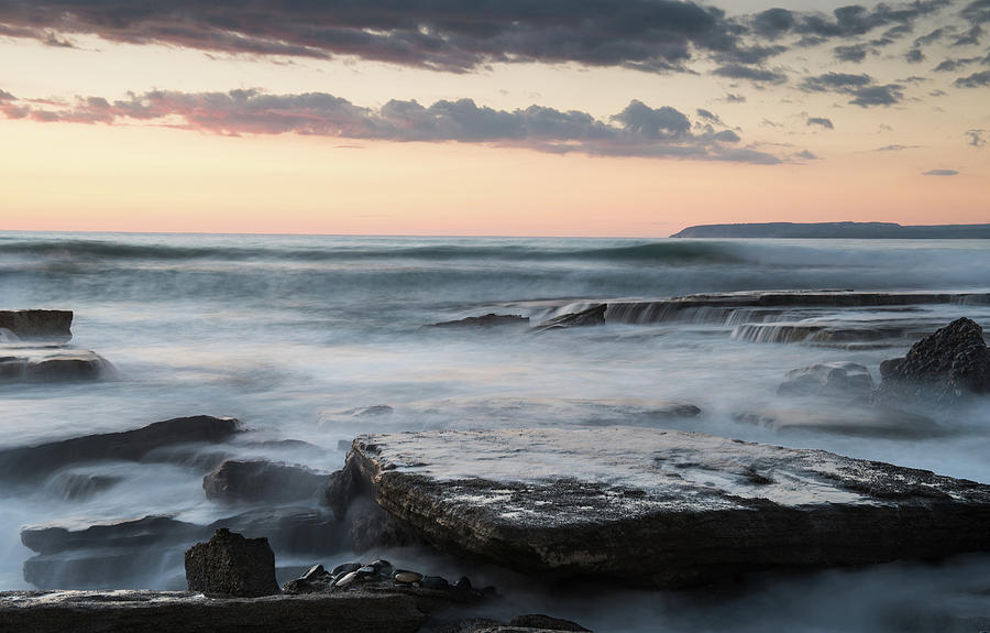 Beautiful dramatic Sunset over a rocky coast Photograph by Michalakis Ppalis