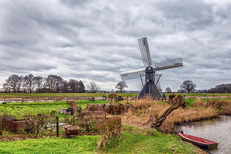 Beautiful landscape with a spiderhead mill in the Netherlands Photograph by Tim Abeln