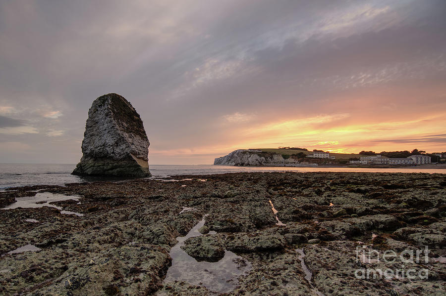 Beautiful sunset over Freshwater Bay with standing stone Photograph by Clayton Bastiani