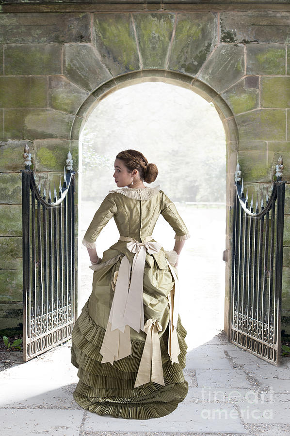 Beautiful Young Victorian Woman Walking Through A Stone Archway Photograph by Lee Avison