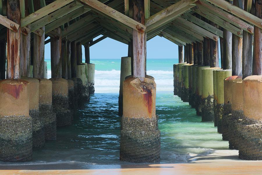 Daytona Beach Photograph - Beneath the Pier by Allen Gray