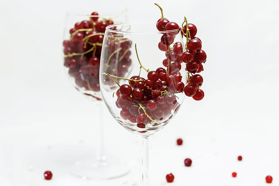 Berries in a wineglass Photograph by Hanna Tor