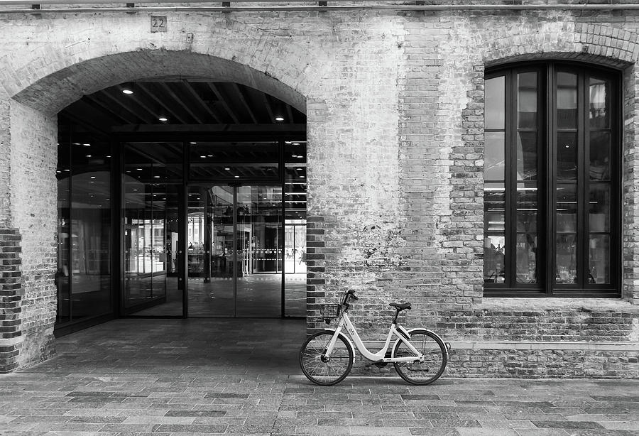 Bicycle and brick Photograph by Roger Lighterness