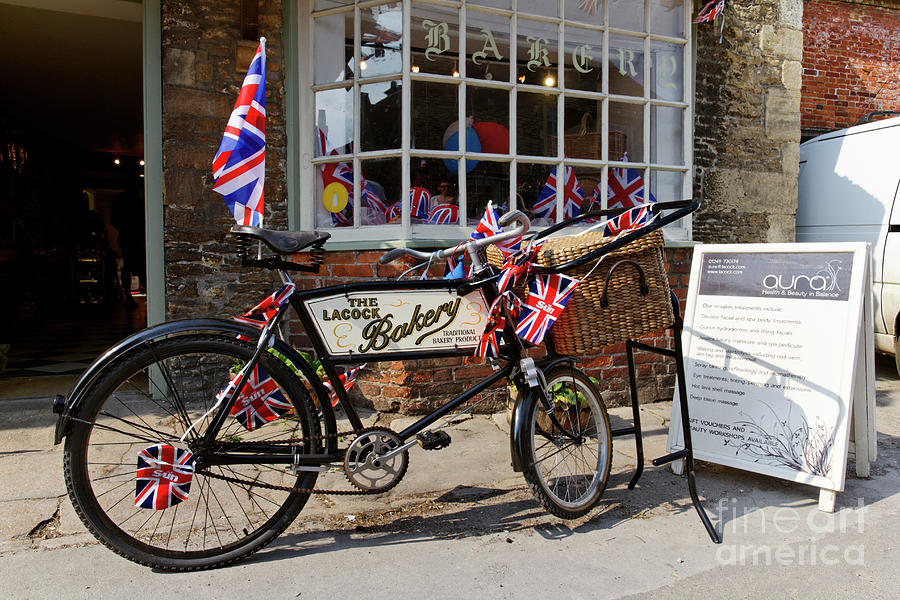 Bicycle outside Lacock Bakery Lacock village Wiltshire England Photograph by Robert Preston