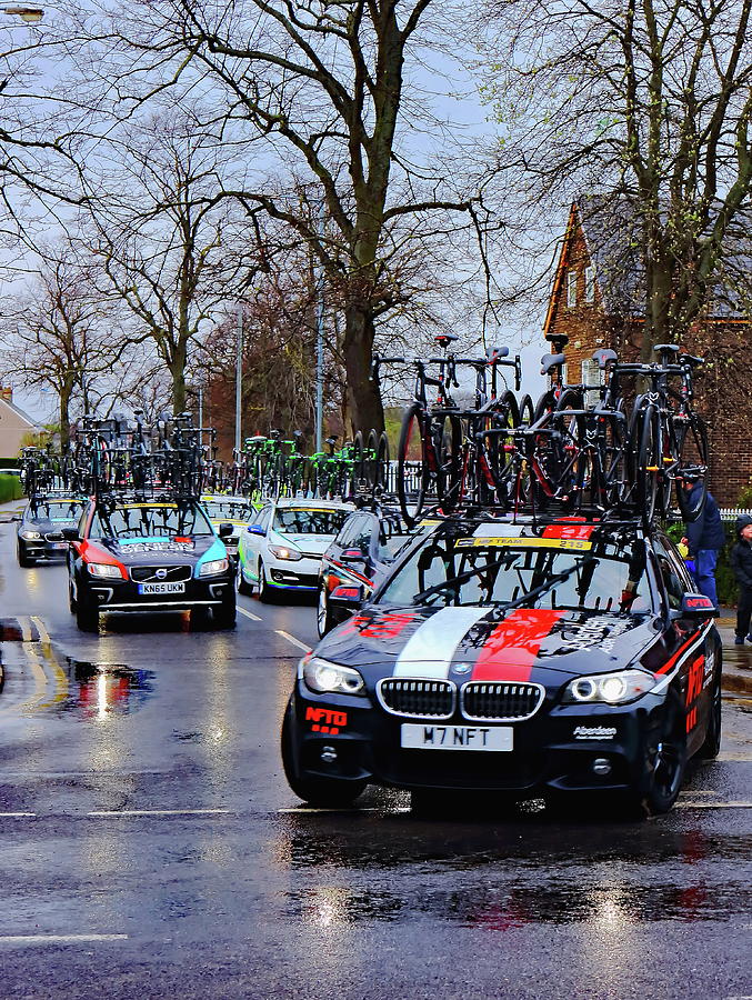 Bicycle Race Team Cars Photograph by Jeff Townsend