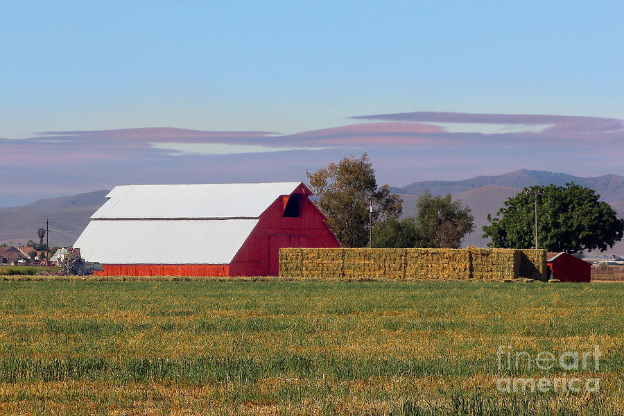 Big Red Barn with Stacks of Hay in Gustine California Photograph by Wernher Krutein