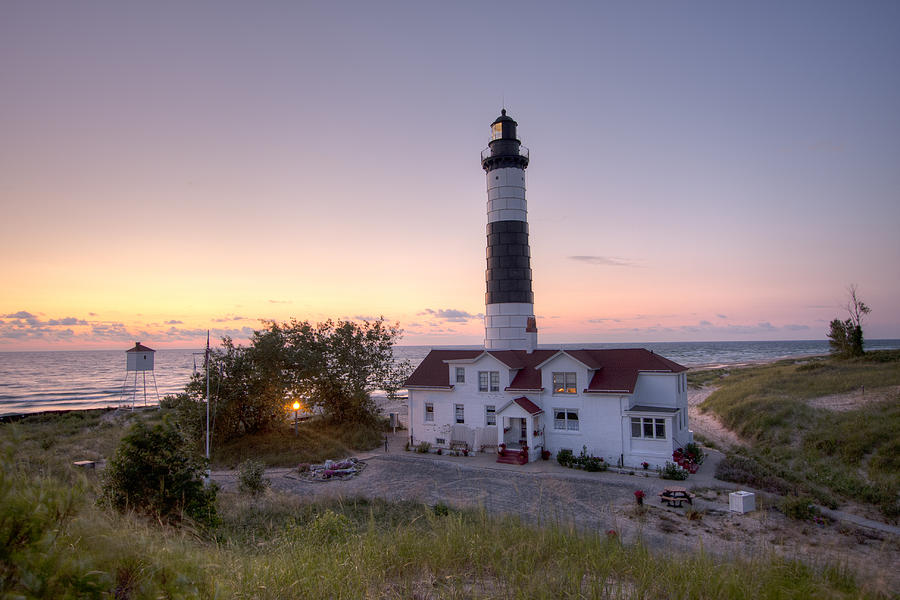 Big Sable Point Lighthouse at Sunset Photograph by Adam Romanowicz